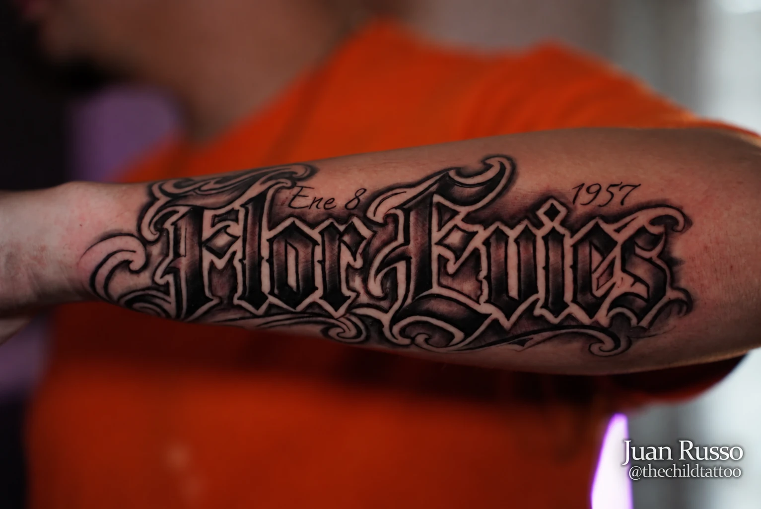 Ornamental lettering tattoo by Juan Russo in Cordova, Memphis.