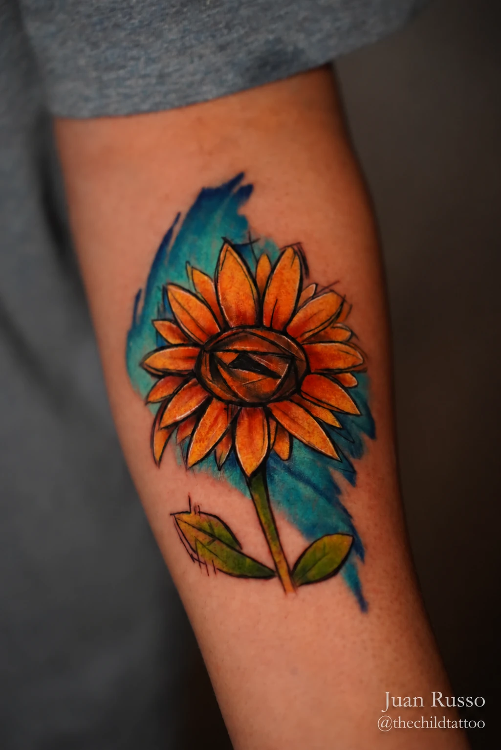Color sunflower tattoo by Juan Russo in Cordova, Memphis.